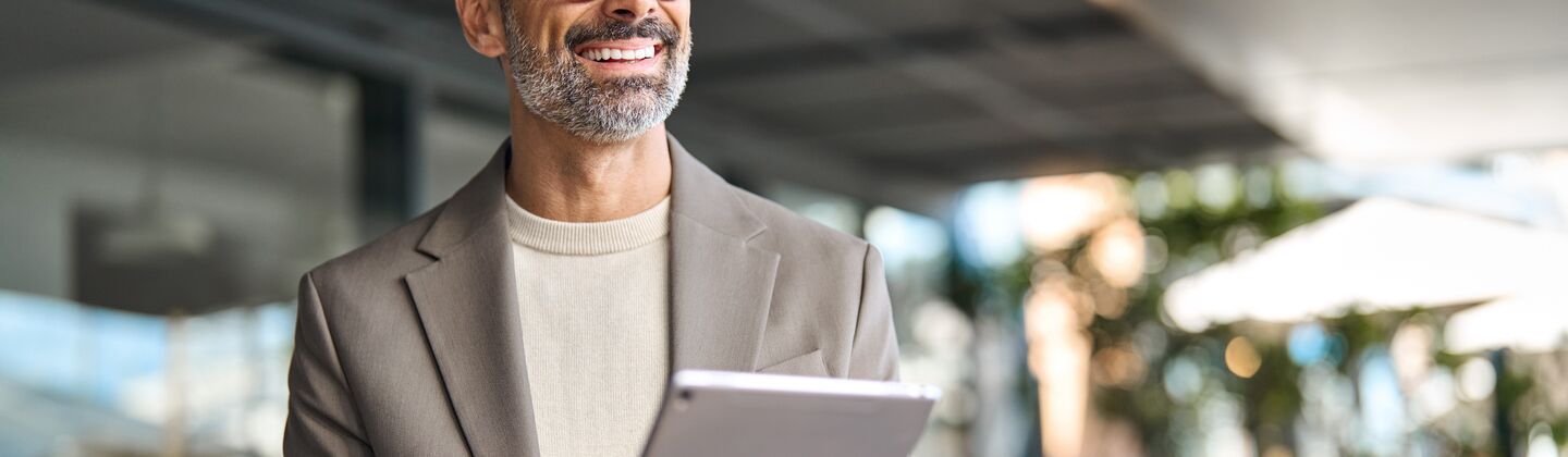 COLOUR IMAGE_businessman_on_tablet_Jun26