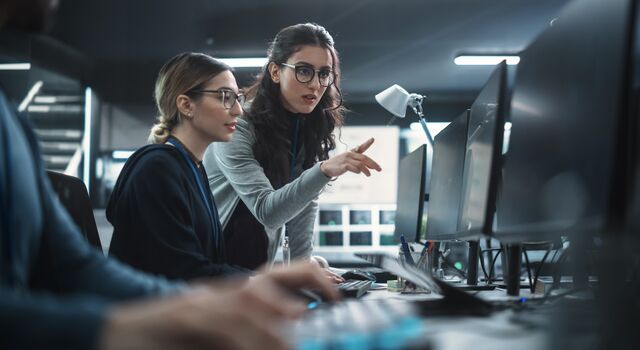 COLOUR-IMAGE_Two-women-working-computers_july26