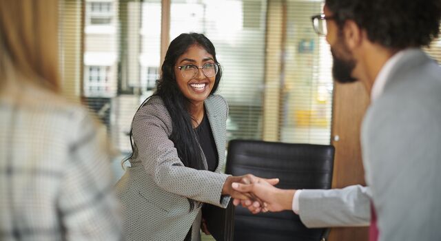 COLOUR-IMAGE_woman-shaking-hands_feb26