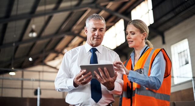 COLOUR-IMAGE_two-colleagues-speaking-over-a-tablet_apr26