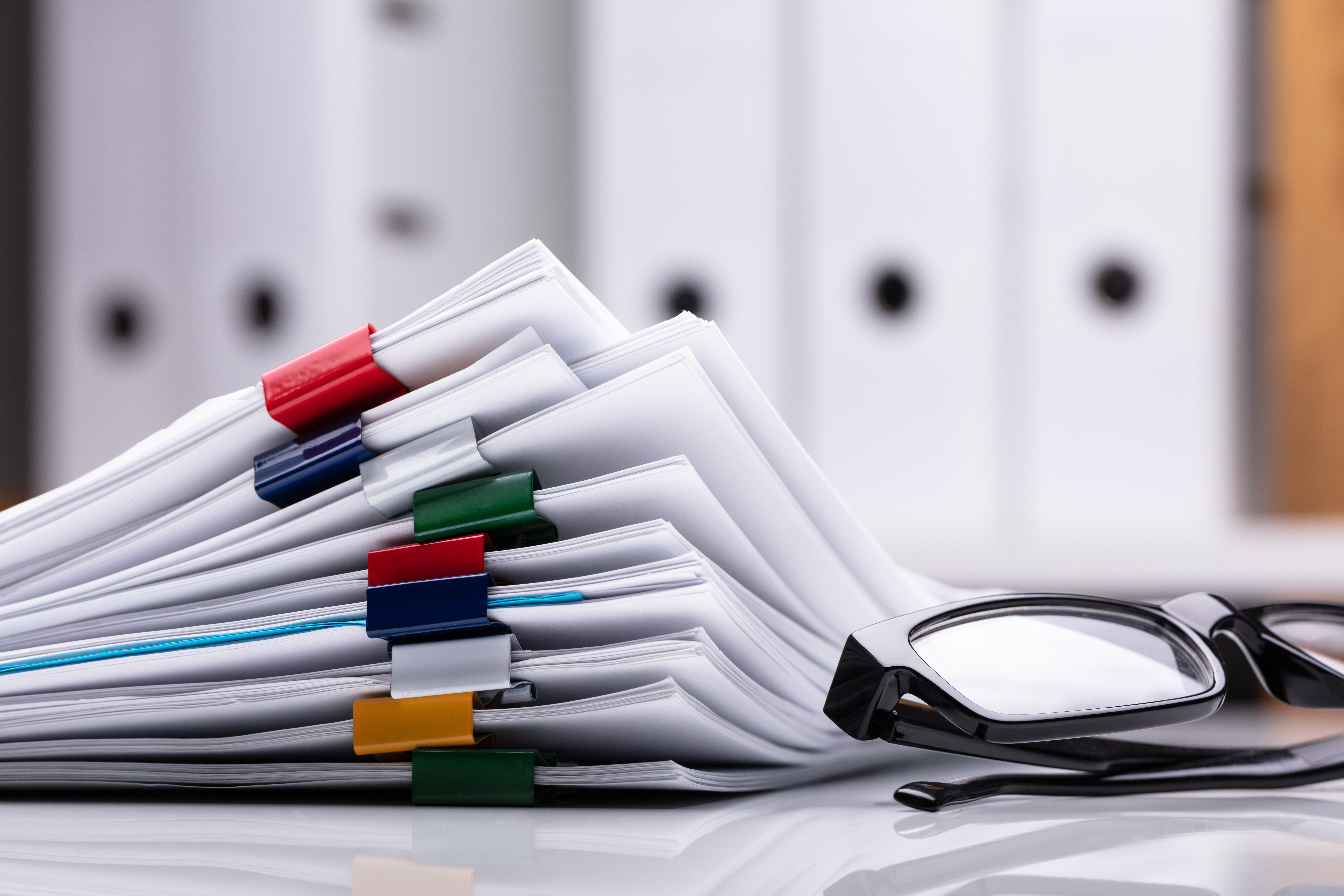 COLOUR-IMAGE_papers-and-glasses_feb26
