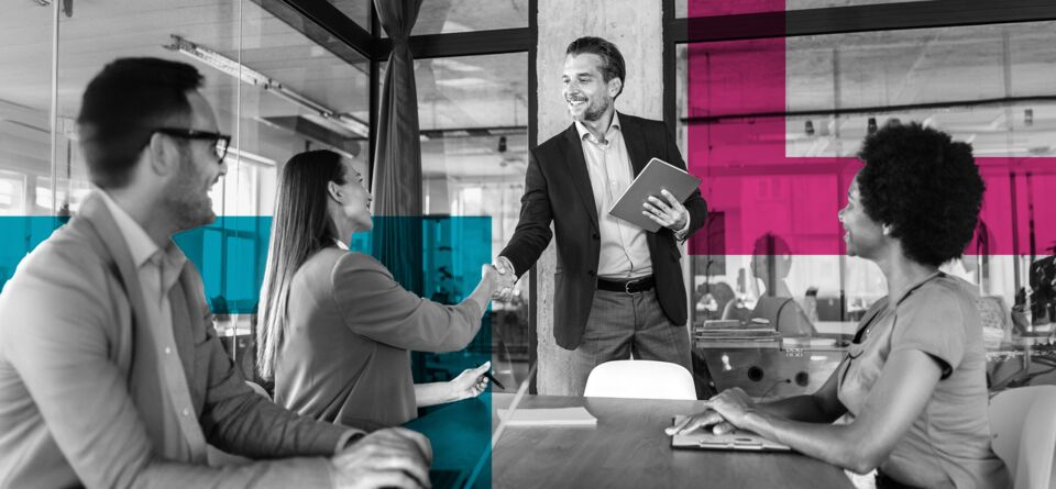 Small JPEG-SINGLE-IMAGE_squares-businesswoman-and-businessman-shaking-hands-across-the-table-1_may24